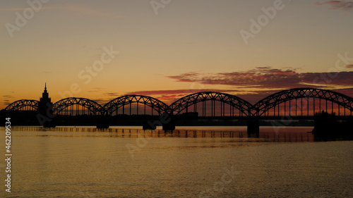 Railway bridge in Riga against the background of dawn in autumn.