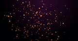 Image of warm glowing orange spots floating on black background
