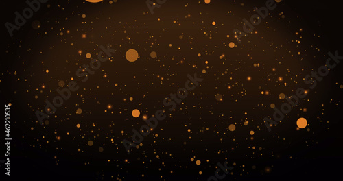 Image of warm glowing orange spots floating on brown background