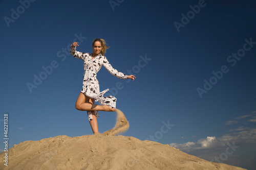 young woman on sandy mountain