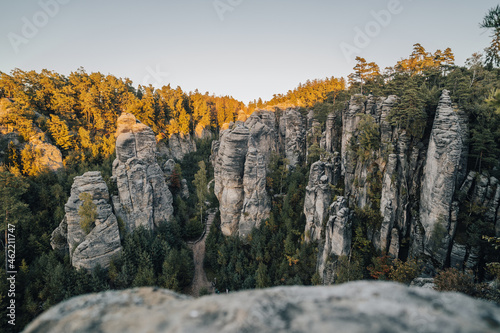 Fantastic autumn view of Prachovské skály, Český ráj (Prachov Sandstones, Bohemian paradise). High sandstone rocks of Cesky Raj and Prachov. Sunser over high rock towers in Czech republic.