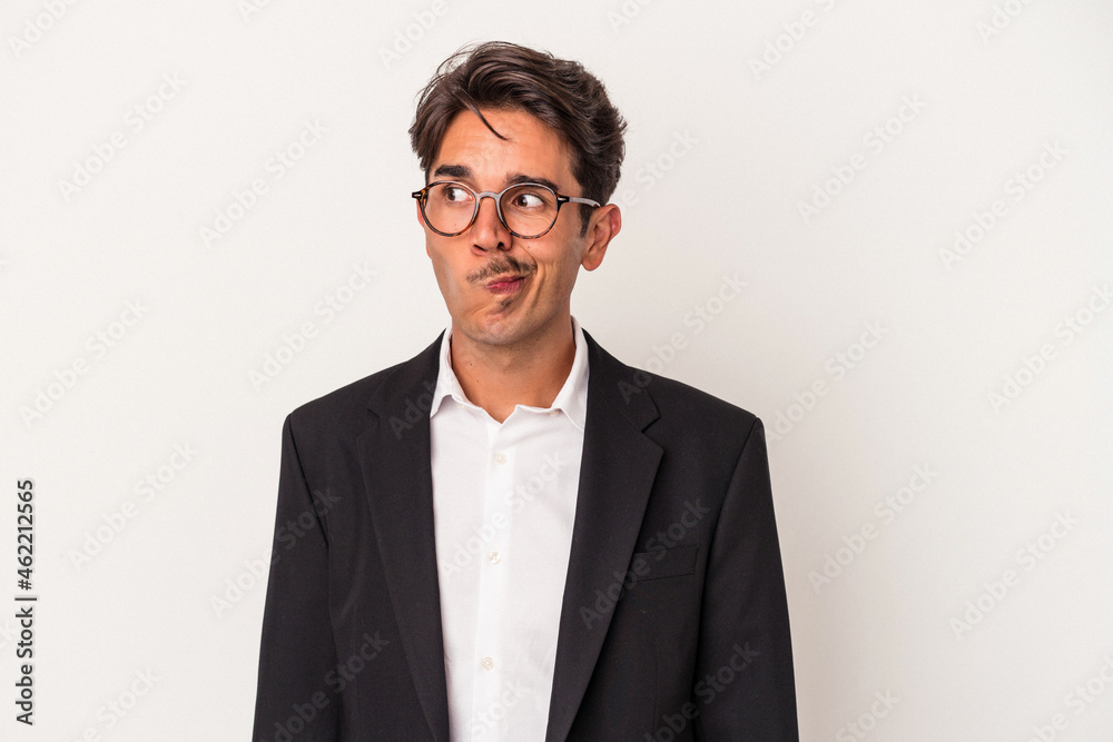 Young mixed race business man isolated on white background confused, feels doubtful and unsure. Young mixed race business man isolated on white background confused, feels doubtful and unsure.