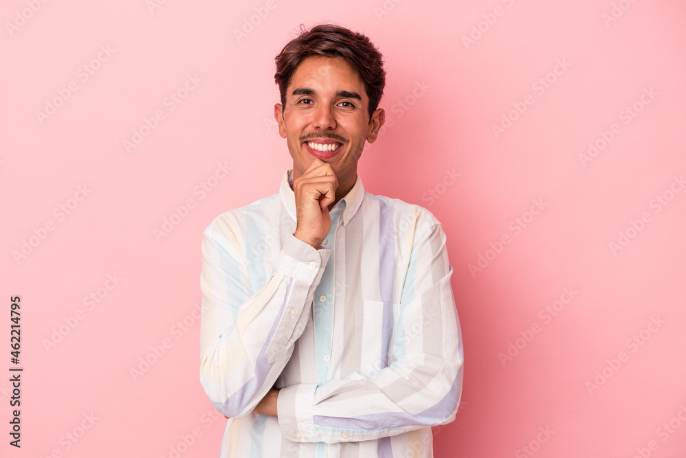 Young mixed race man isolated on white background smiling happy and confident, touching chin with hand.