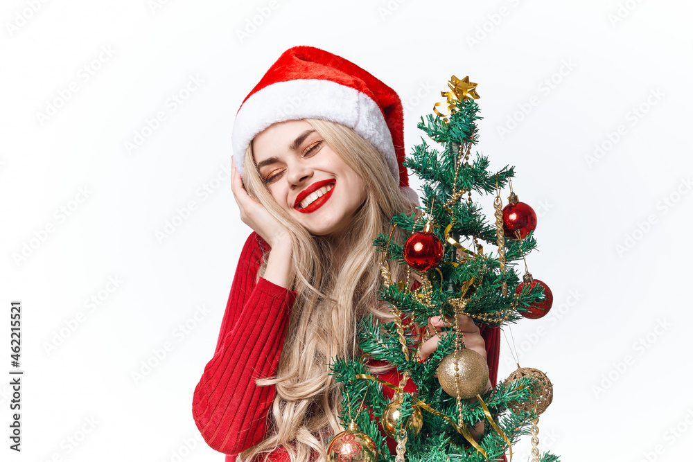 pretty woman with christmas tree in hands toys christmas light background pretty woman with christmas tree in hands toys christmas light background