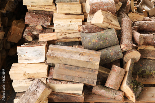 Closeup of chopped firewood. Firewood stacked and prepared for winter. Pile of wood.