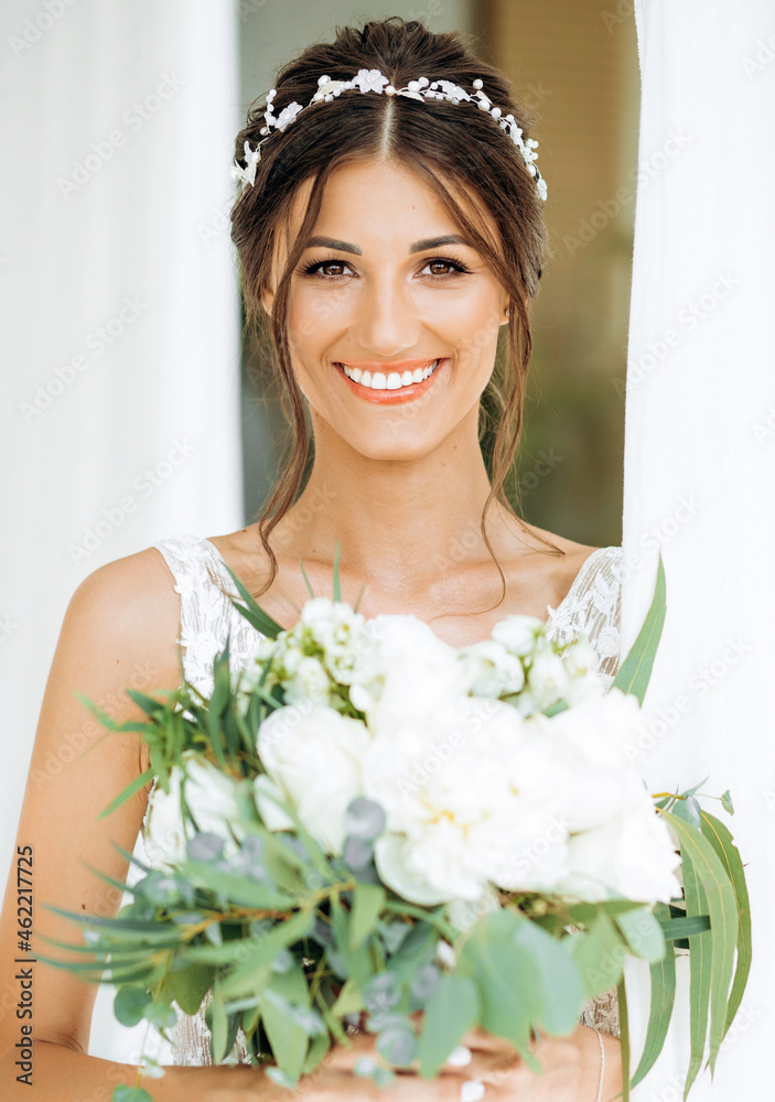 Portrait of a beautiful bride with a bouquet of flowers Portrait of a beautiful bride with a bouquet of flowers