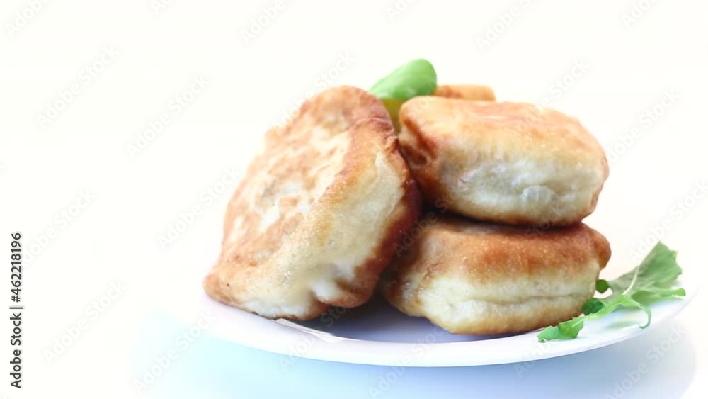 fried pies with meat in a plate on a white fried pies with meat in a plate on a white