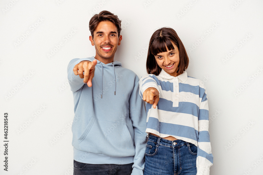 Young mixed race couple isolated on white background cheerful smiles pointing to front. Young mixed race couple isolated on white background cheerful smiles pointing to front.