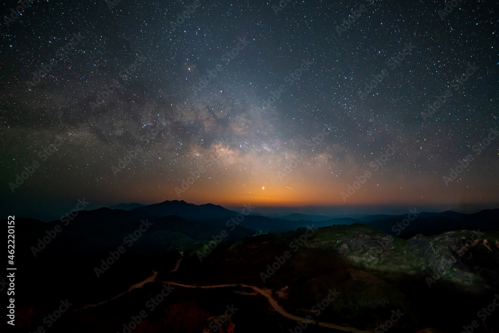 Panorama view universe space shot of milky way galaxy with stars on night sky background at mountains landscape Thailand