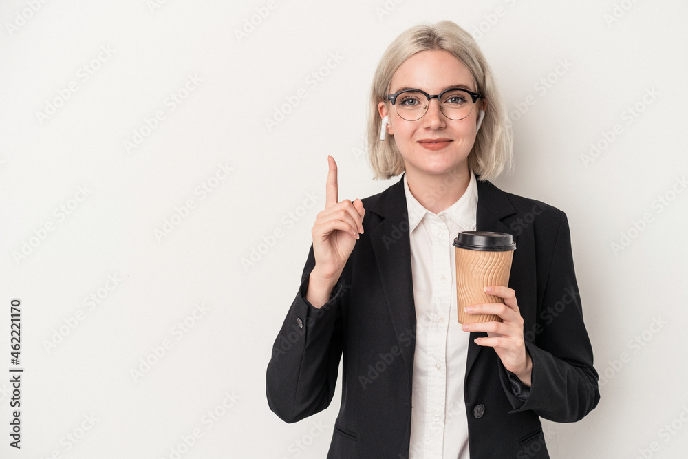 Young caucasian business woman holding take away coffee isolated on white background showing number one with finger. Young caucasian business woman holding take away coffee isolated on white background showing number one with finger.