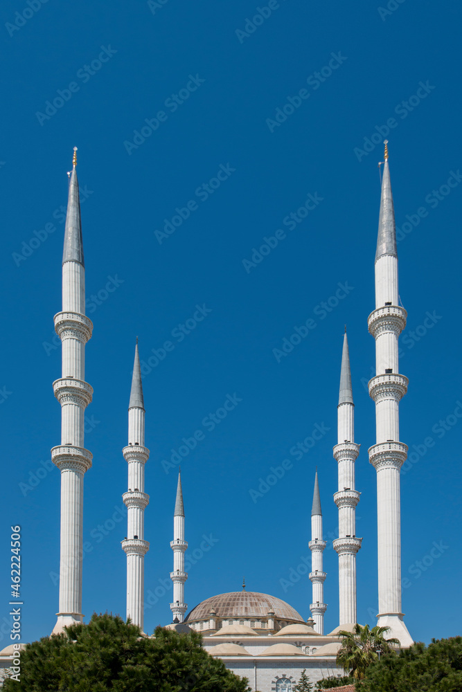 Image of the six minarets of a Muslim mosque in southern Turkey with Ottoman architecture