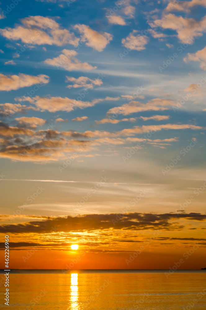 Sunset over the sea. Reflection of sunlight in the sea waves. The sky in the sunset rays. Sunset over the sea. Reflection of sunlight in the sea waves. The sky in the sunset rays.