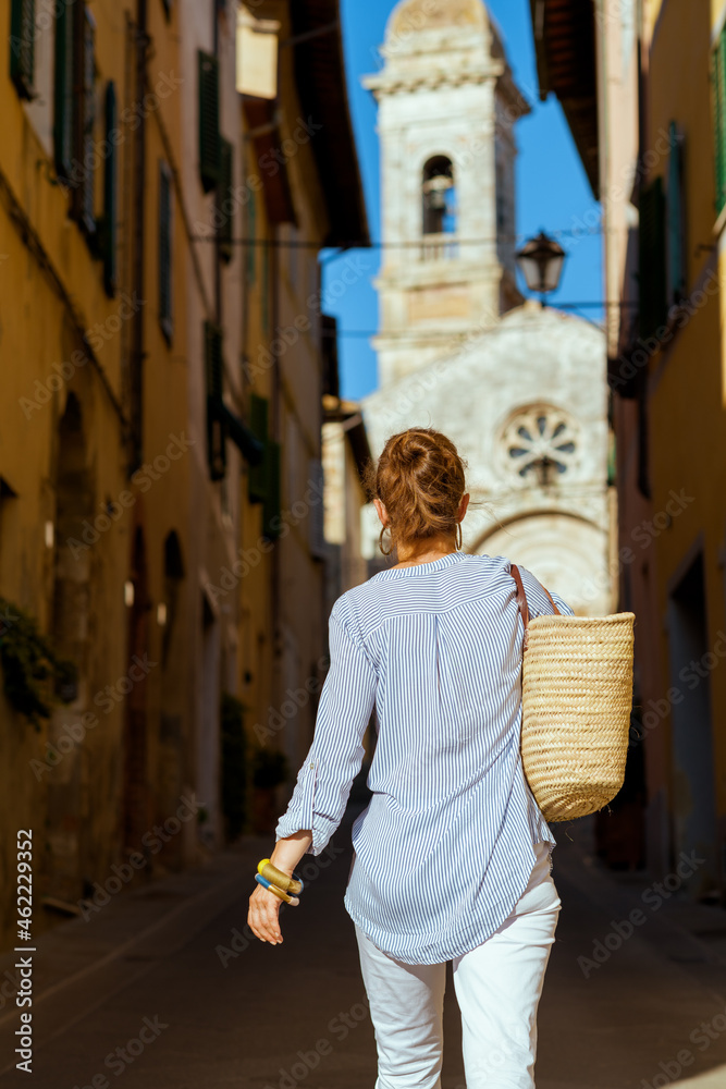stylish traveller woman enjoying promenade in Tuscany, Italy