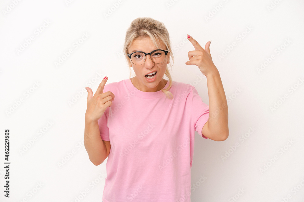 Young Russian woman isolated on white background showing a disappointment gesture with forefinger. Young Russian woman isolated on white background showing a disappointment gesture with forefinger.