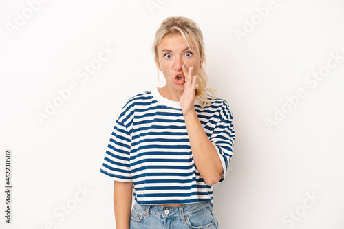 Cuadro en lienzo Young Russian woman isolated on white background is saying a secret hot braking