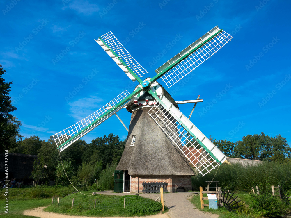 Historical traditional dutch windmill in summer. Arnhem, Provinz Gelderland, The Nederlands. Tourism and vacations concept.