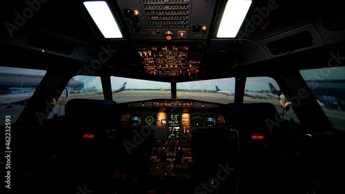 фотографія Empty cockpit or flight deck of modern passenger plane