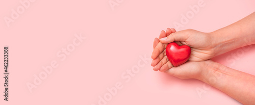 Health care concept with heart in hands