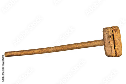 Large old weathered wooden hammer with woodworm isolated on white