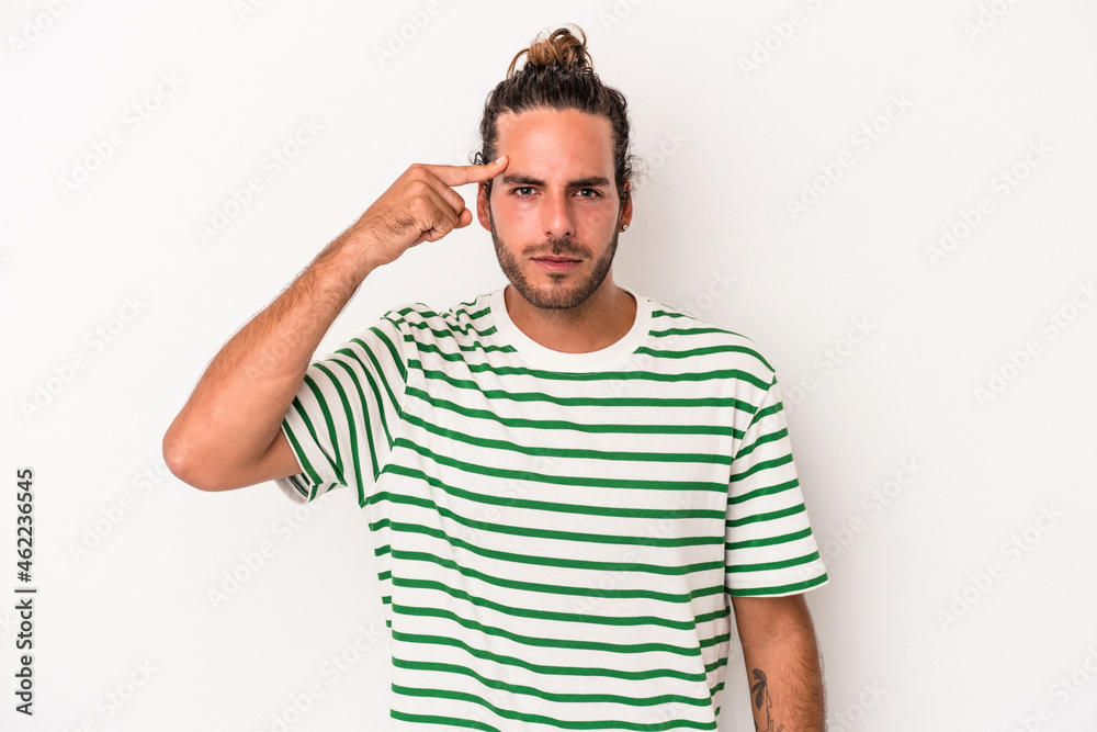 Young caucasian man isolated on white background pointing temple with finger, thinking, focused on a task. Young caucasian man isolated on white background pointing temple with finger, thinking, focused on a task.