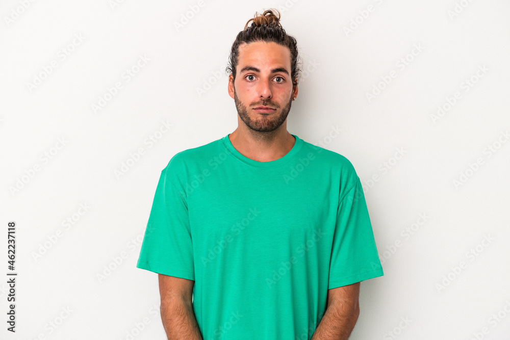 Young caucasian man isolated on white background sad, serious face, feeling miserable and displeased.