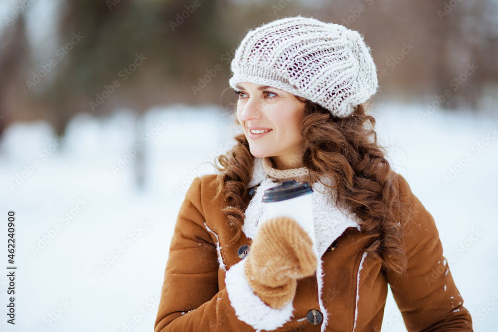 happy elegant woman outside in city park in winter happy elegant woman outside in city park in winter
