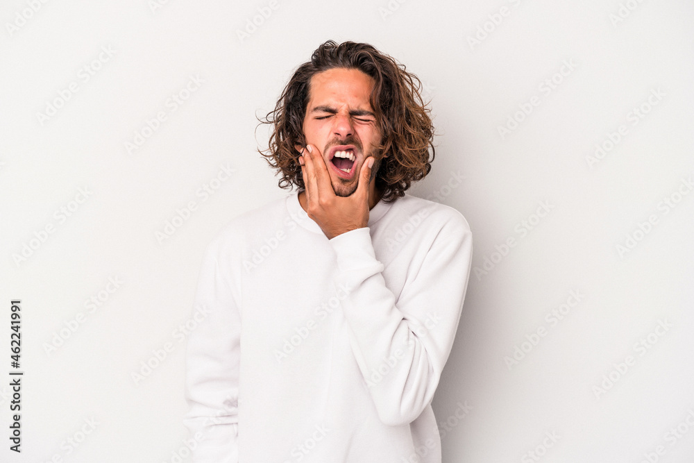 Young caucasian man isolated on gray background having a strong teeth pain, molar ache. Young caucasian man isolated on gray background having a strong teeth pain, molar ache.