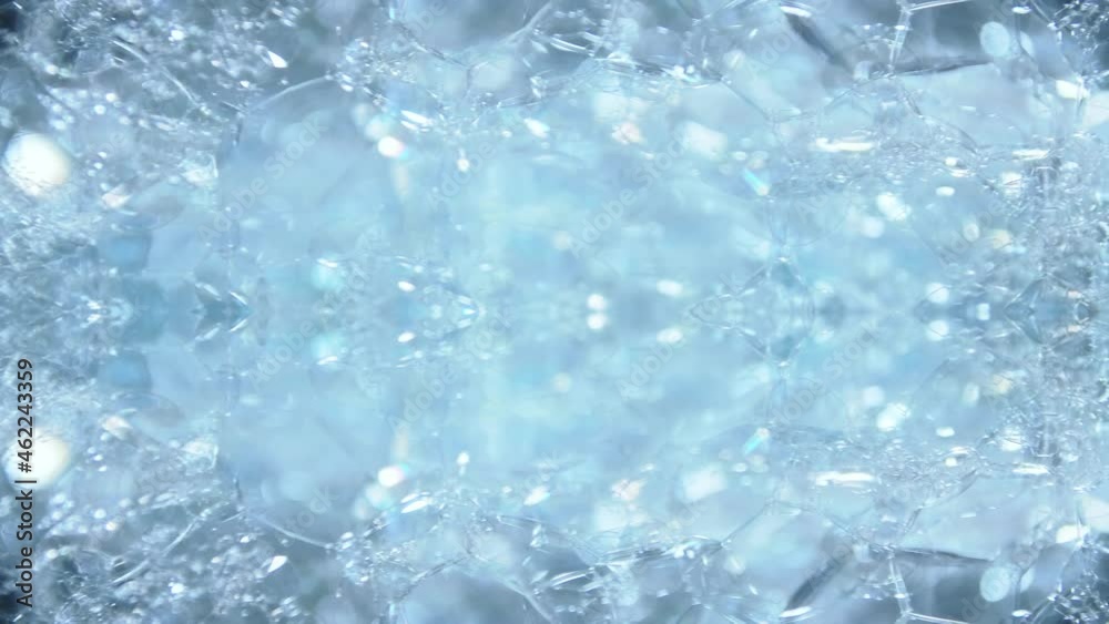 Artistic blur bubbles and dots with rotation slow motion and blue color copy space background. Artistic blur bubbles and dots with rotation slow motion and blue color copy space background.