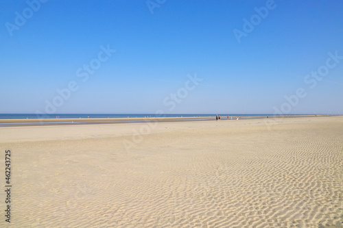 Walk and sun fun on the beach at low tide on the wide sandy beach of St. Peter Ording  North Sea - Germany
