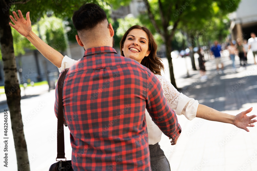 Obraz premium Happy young couple in the city. Loving couple hugging outdoors.