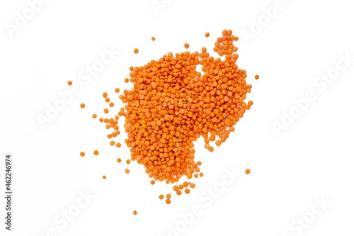 Red lentil, top view of raw red lentil grains on isolated white background. photo