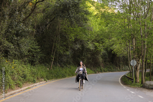young girl riding a cheerful urban bicycle © Ainhoa