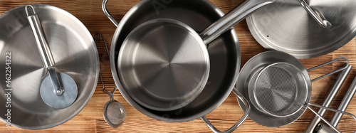 Photos Kitchen utensil on wooden table, top view