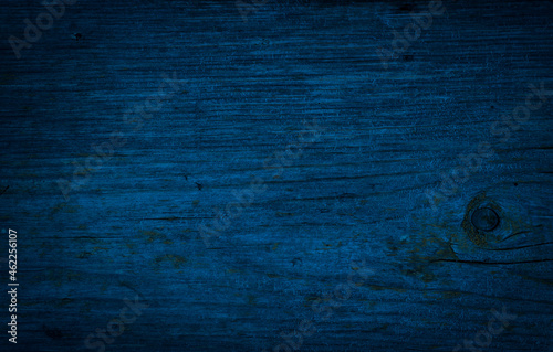 Navi blue wood old rough surface, dark indigo woody background, grunge texture. photo
