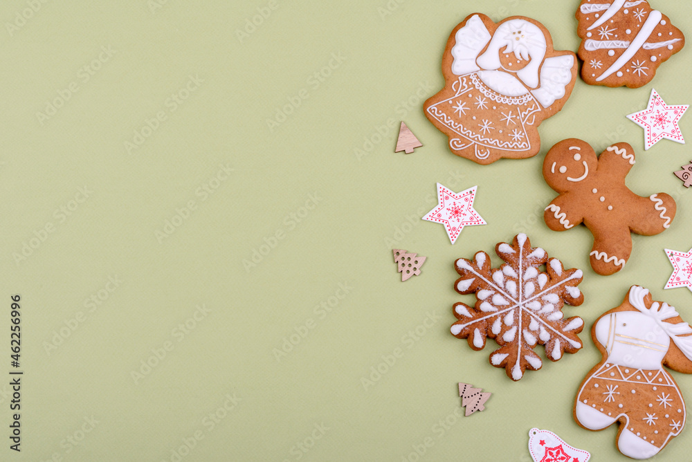 Christmas festive gingerbread made at home on a color background Christmas festive gingerbread made at home on a color background