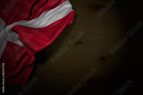 beautiful independence day flag 3d illustration. - dark illustration of Denmark flag with big folds on dark wood with free place for content