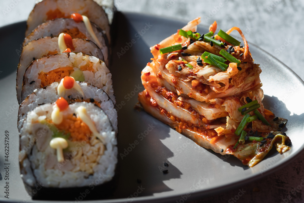 Korean traditional food Kimbap rolls slices, served with Kimchi Korean traditional food Kimbap rolls slices, served with Kimchi