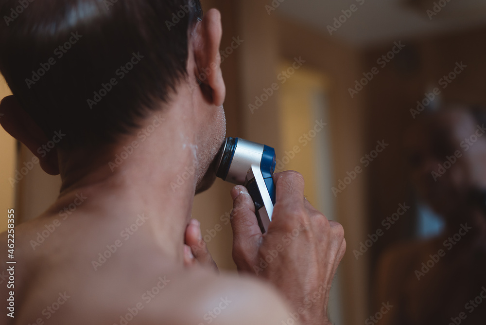 Fototapeta premium Senior man using shaving in toilet, Lifestyle of men’s daily routine.