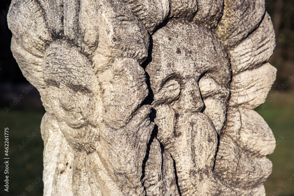 Two faces of the pagan four-sided god Vsyuvydyd. (joy-youth, old age-sadness - concept)