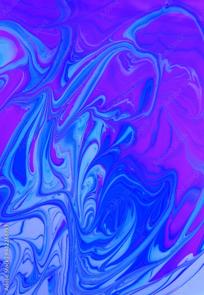 Abstract background of blue-pink marble. Acrylic paint mixes freely and creates an interesting pattern. Bright saturated shades. Background for the cover of a laptop, laptop. Abstract background of blue-pink marble. Acrylic paint mixes freely and creates an interesting pattern. Bright saturated shades. Background for the cover of a laptop, laptop.