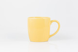 yellow coffee cup on a white background,Yellow tea cup isolated on white.