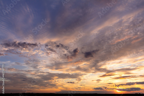 Colorful sunset with clouds in the evening © lunarvogel