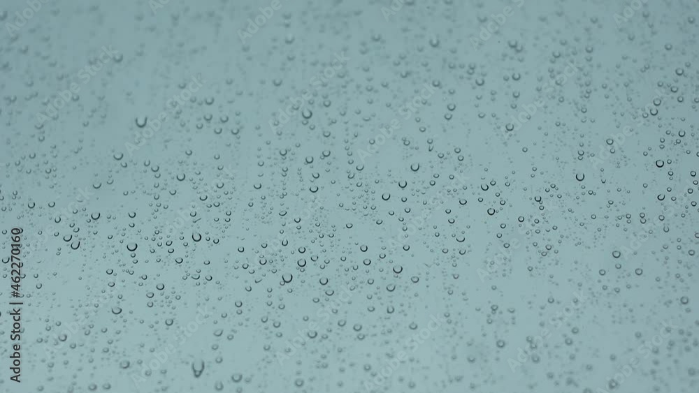 Heavy rainy season. Disappointing weather forecast outside the window, rain and fog. Non-flying weather, flight is delayed. raindrops are flowing on the windows of the car. selective focus Heavy rainy season. Disappointing weather forecast outside the window, rain and fog. Non-flying weather, flight is delayed. raindrops are flowing on the windows of the car. selective focus