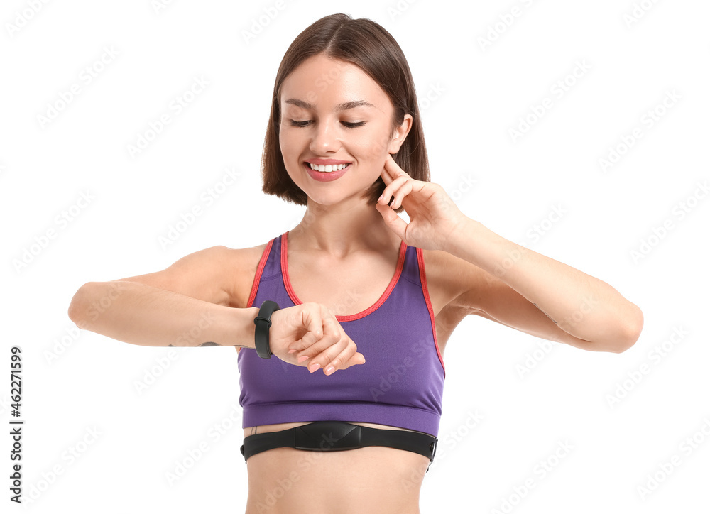 Sporty female runner checking pulse on white background Sporty female runner checking pulse on white background