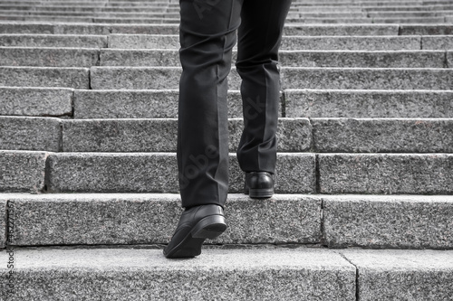Businessman walking up the ...