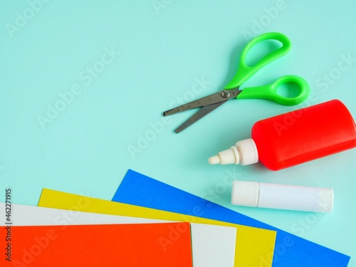 A set of stationery for creativity. Colored paper  glue  glue stick  scissors. Copy space. Place for your text. Back to school soon.