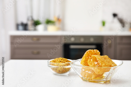 Bowl of honey combs on table in kitchen