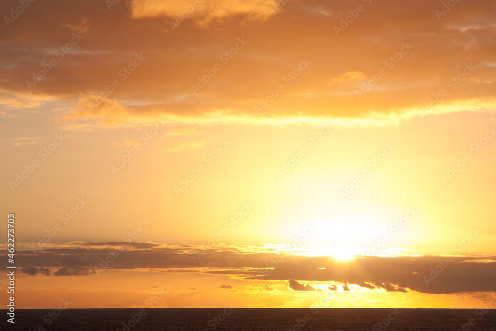 Delightful golden sunset over the ocean from a height.