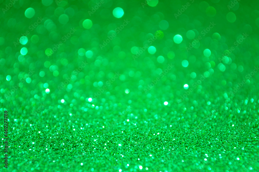 Green abstract glitter background with defocused lights Green abstract glitter background with defocused lights