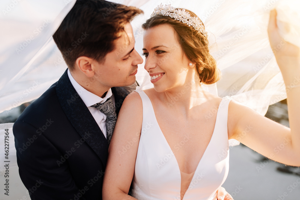 Just married couple under the bride veil Just married couple under the bride veil